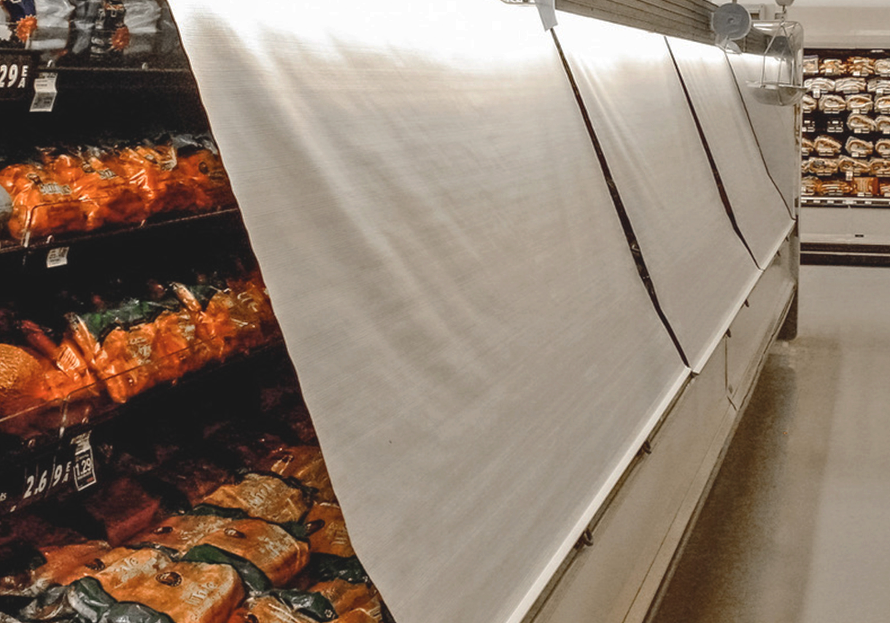 Night covers in a chilled display case in a grocery store